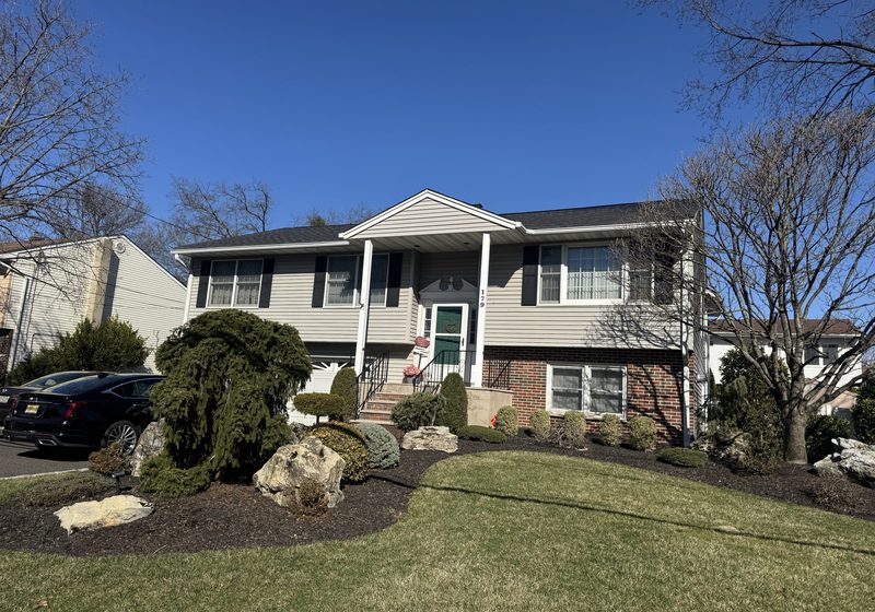 Bi-level home with a landscaped front yard in Edison, NJ