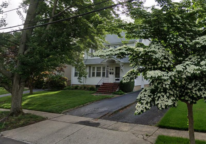 Colonial home behind a flowering dogwood in Westfield, NJ